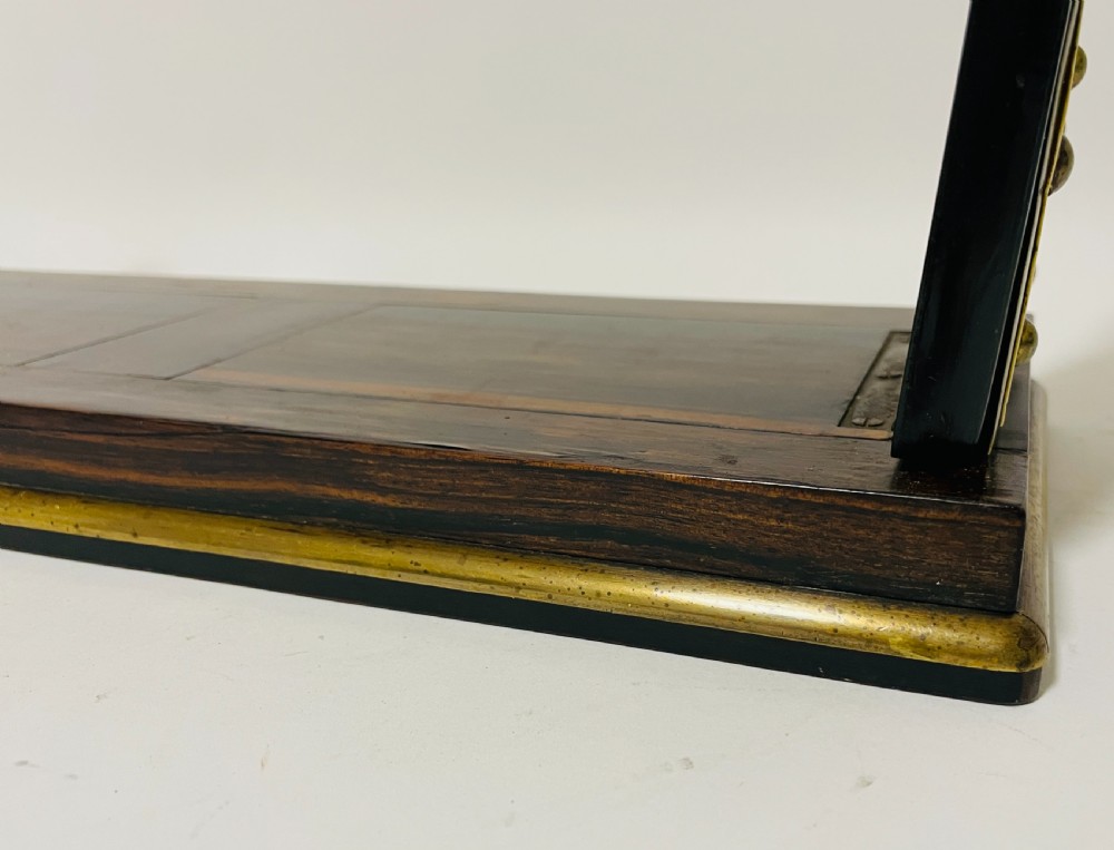 An antique Victorian coromandel wood expanding book slide featuring brass trim and decorative bone mounts pinned with studs. View III