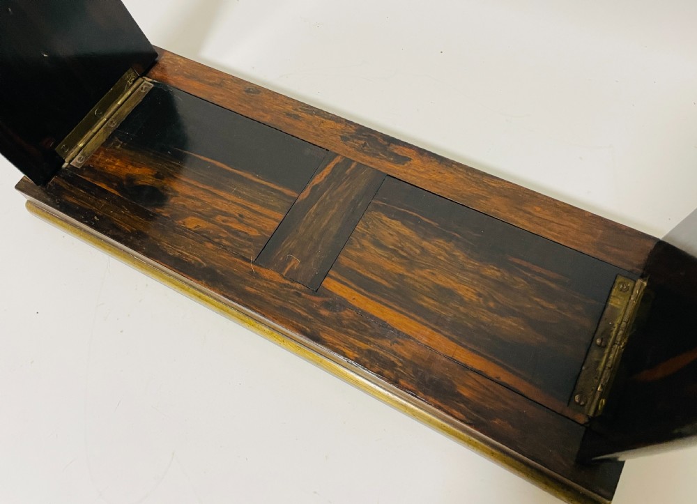 An antique Victorian coromandel wood expanding book slide featuring brass trim and decorative bone mounts pinned with studs. View IV