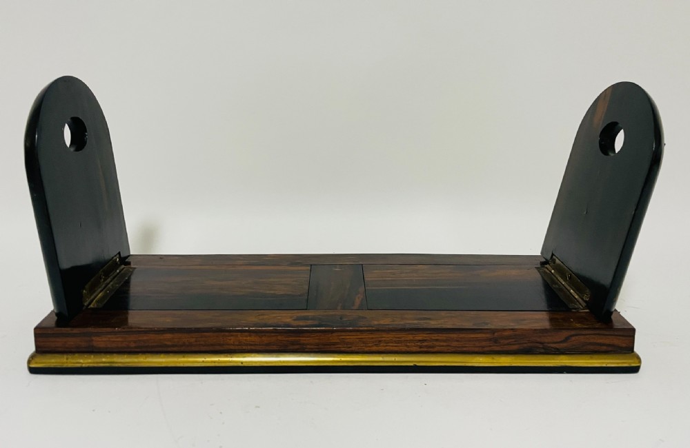 An antique Victorian coromandel wood expanding book slide featuring brass trim and decorative bone mounts pinned with studs. View IX