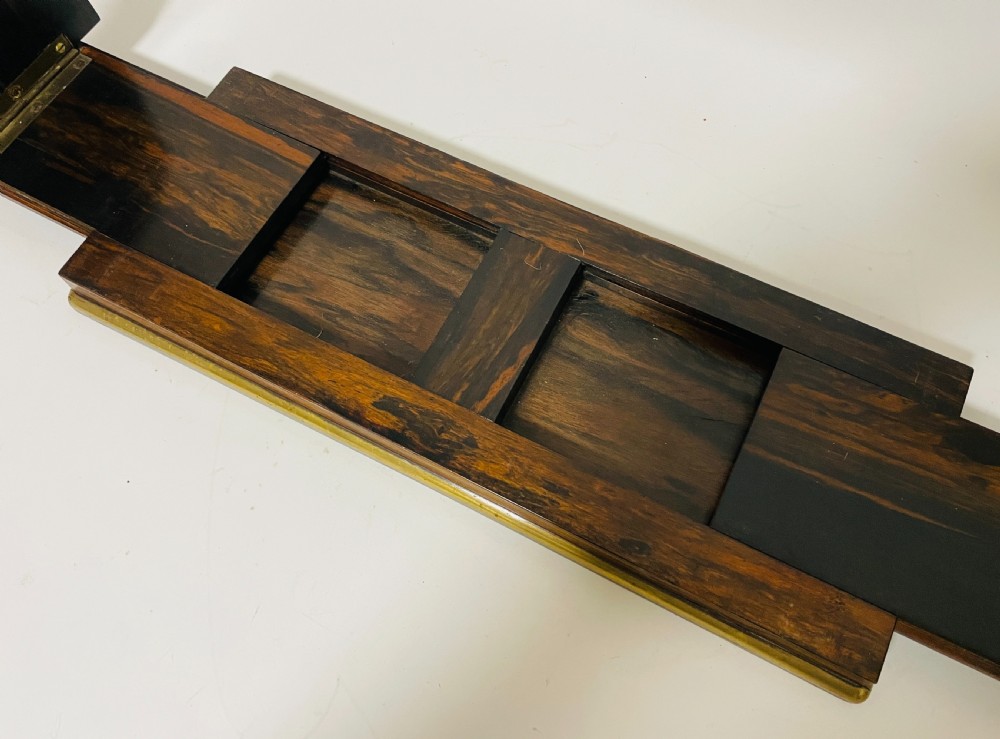 An antique Victorian coromandel wood expanding book slide featuring brass trim and decorative bone mounts pinned with studs. View XIII