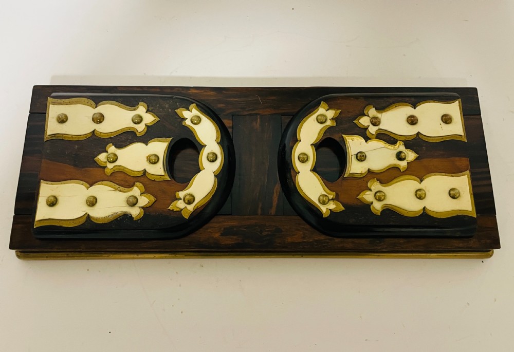 An antique Victorian coromandel wood expanding book slide featuring brass trim and decorative bone mounts pinned with studs. View XIV