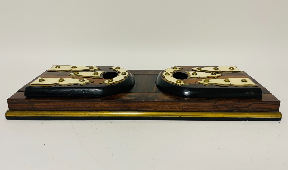 An antique Victorian coromandel wood expanding book slide featuring brass trim and decorative bone mounts pinned with studs. View XVI
