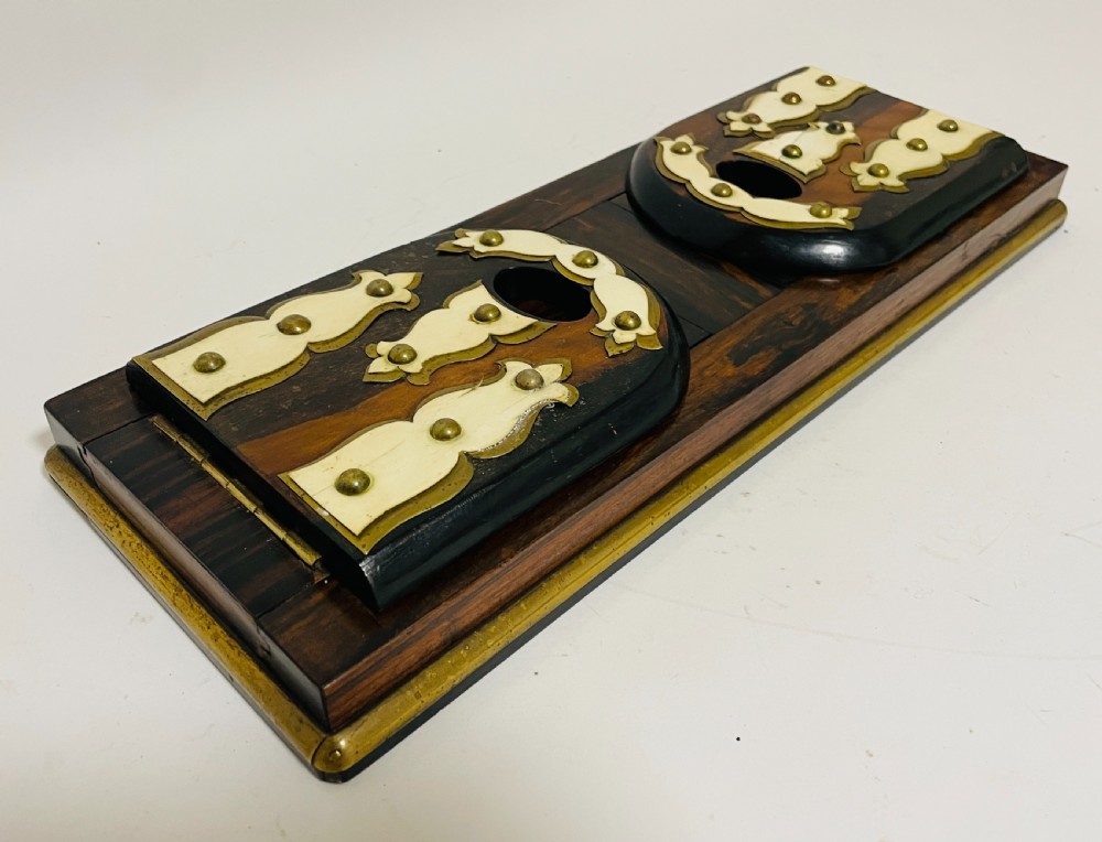 An antique Victorian coromandel wood expanding book slide featuring brass trim and decorative bone mounts pinned with studs. View XVII