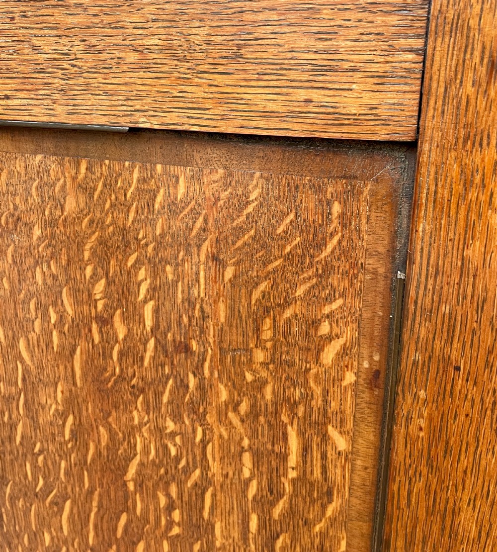 A floor-standing Georgian oak corner cupboard featuring double panelled doors and a moulded top cornice. View XVII