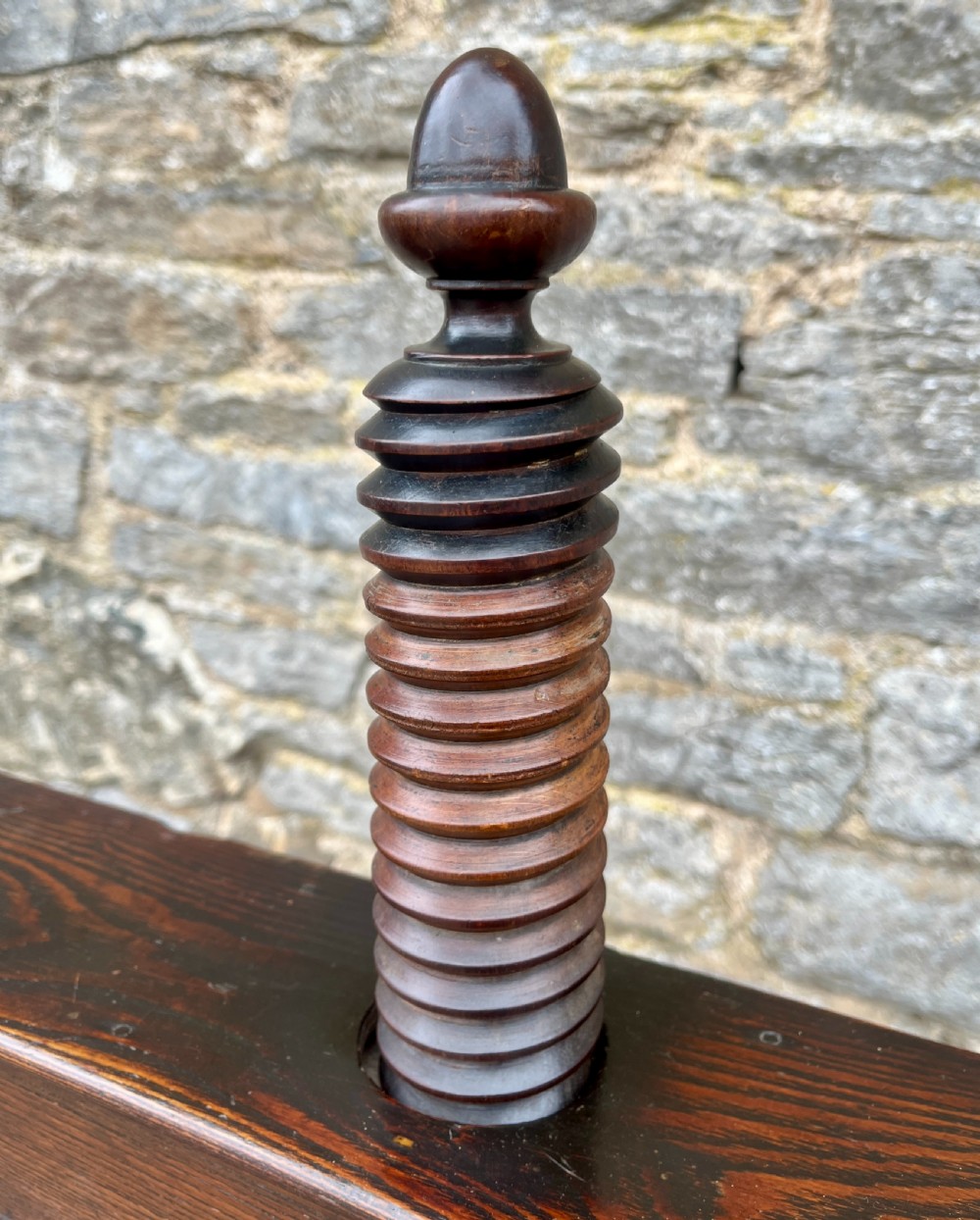 An antique oak and elm book press table featuring a central turned wooden screw mechanism above a single drawer with two round knobs. View XVI