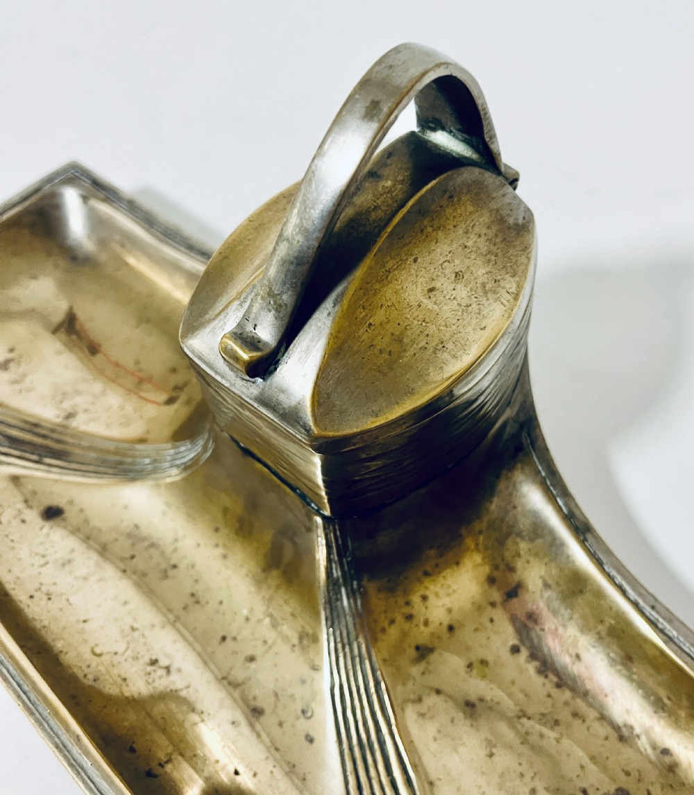 An antique Art Nouveau silver-plated desk stand featuring a central hinged inkwell flanked by two pen trays. View XIII