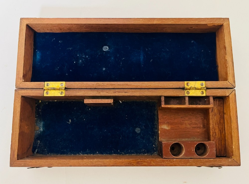 A Victorian brass drum microscope seated in its original fitted mahogany box with brass clasps. View VI