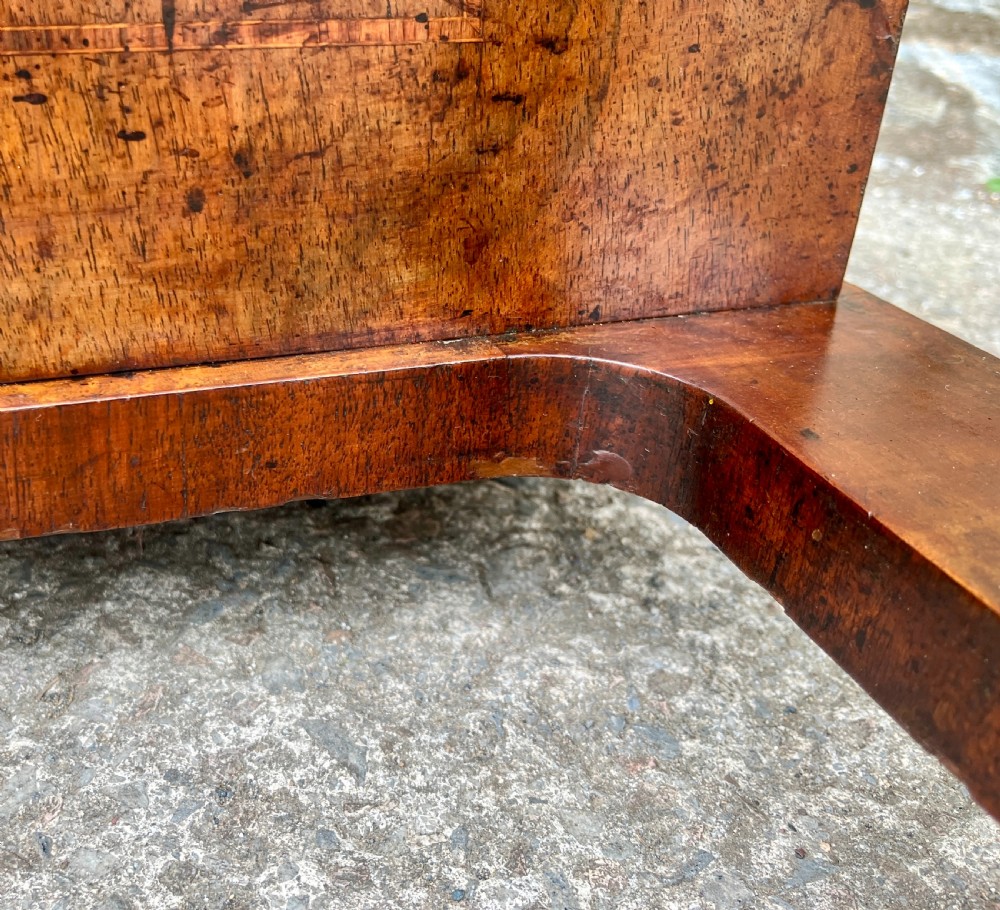A Victorian burr walnut Davenport desk featuring a sloped writing top with a green leather insert and carved acanthus leaf front supports. View XXIII