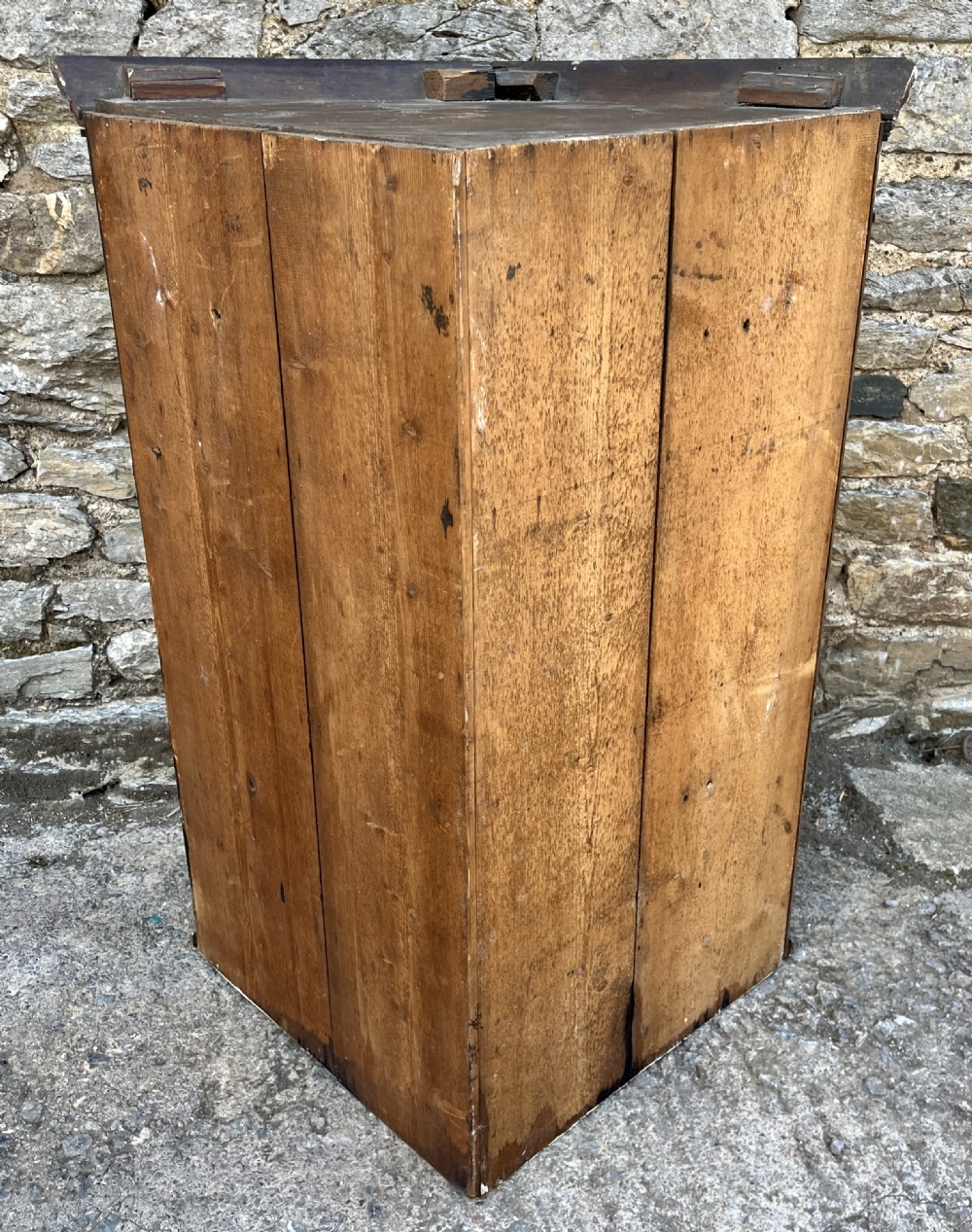 A Georgian dark oak wall-hanging corner cupboard featuring twin fielded panel doors and decorative brass H-hinges. View XIII