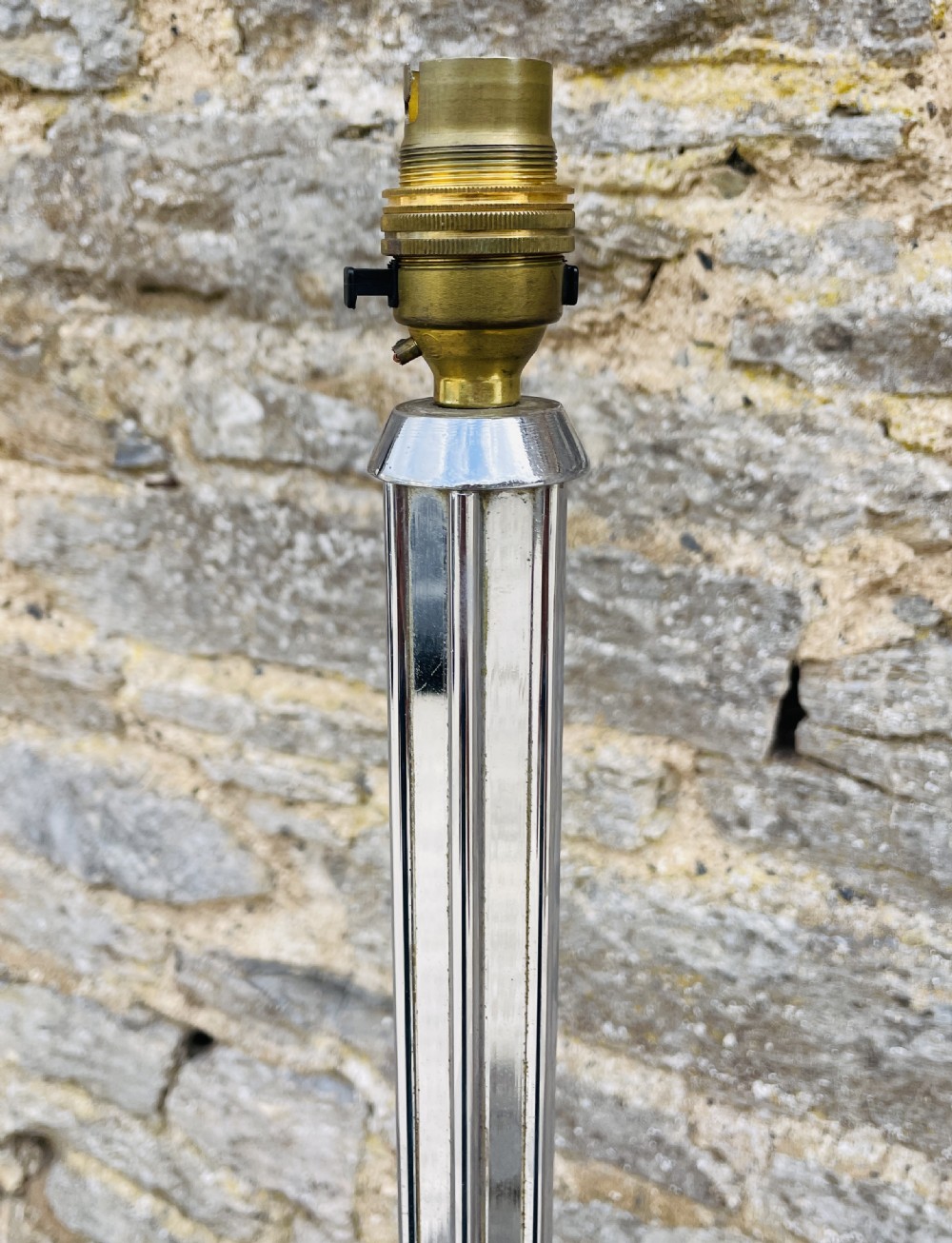 An Art Deco chrome standard lamp featuring a vertical fluted column set upon a polished hexagonal base. View IV