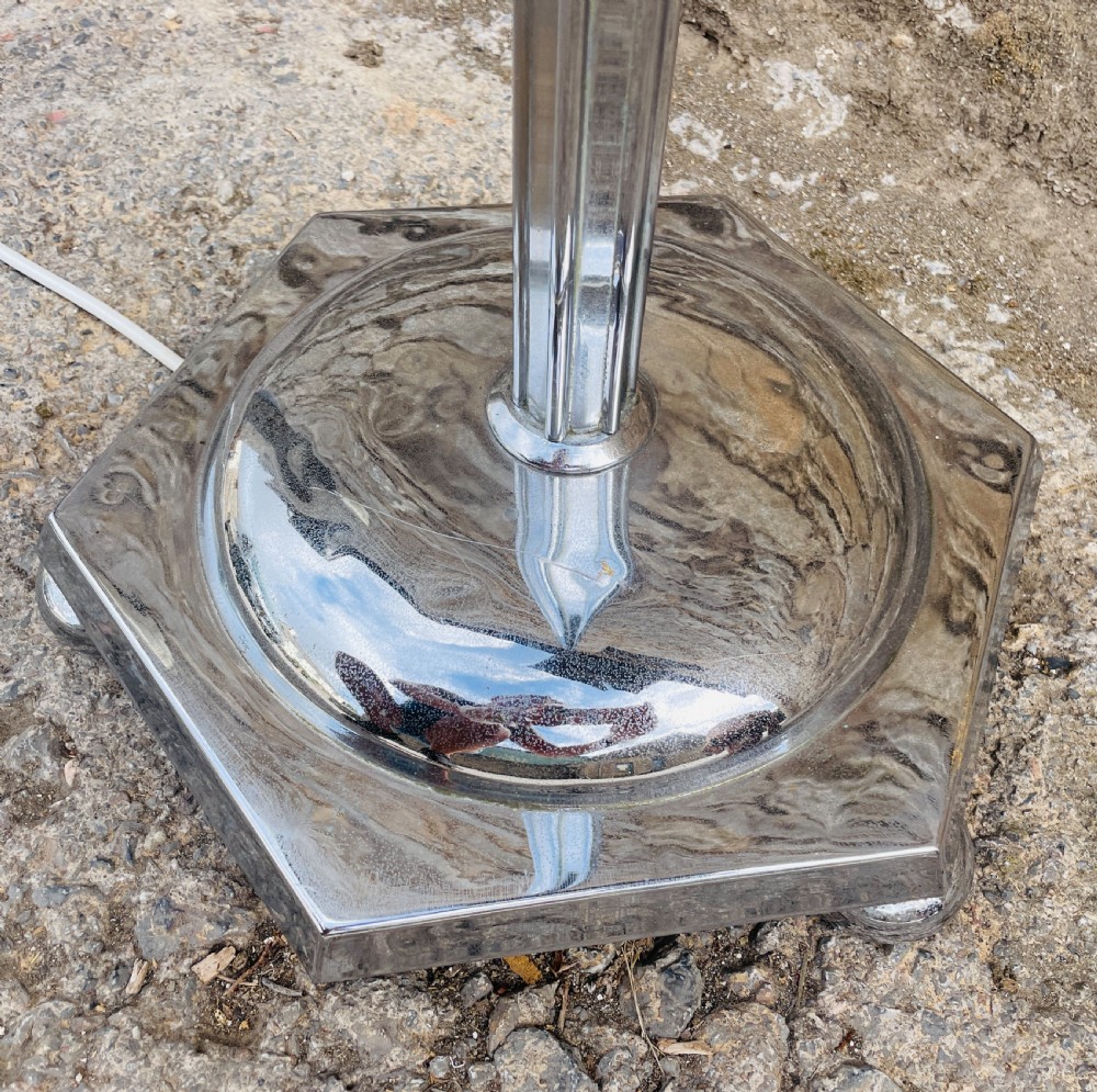 An Art Deco chrome standard lamp featuring a vertical fluted column set upon a polished hexagonal base. View VI