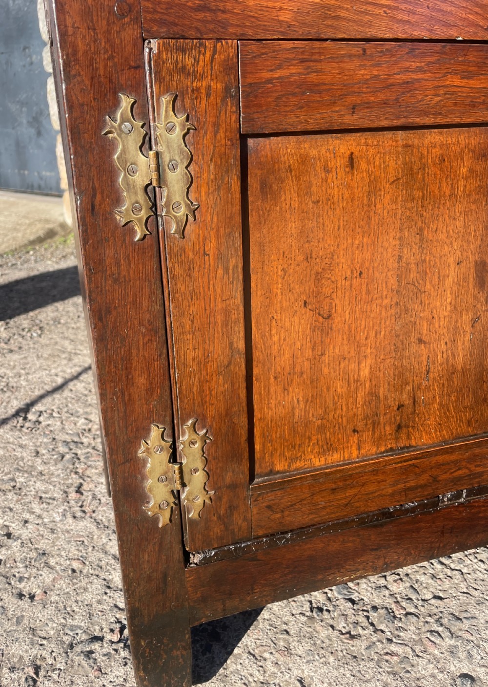 An antique dark oak Georgian dog kennel dresser featuring an open shelf rack above three drawers and two cupboard doors. View XIX