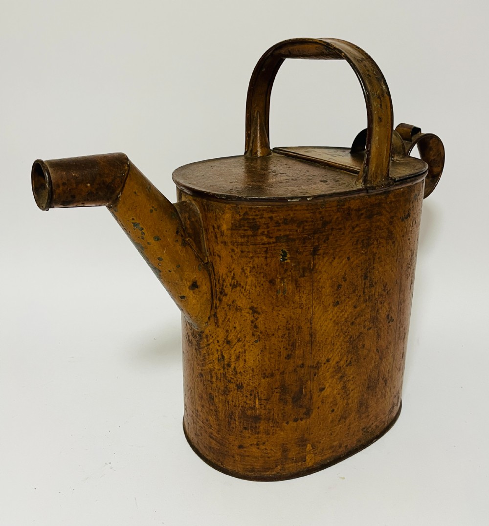 A Victorian painted tinplate hot water can featuring an overhead carrying handle, side loop handle, hinged lid, and angled spout. View II