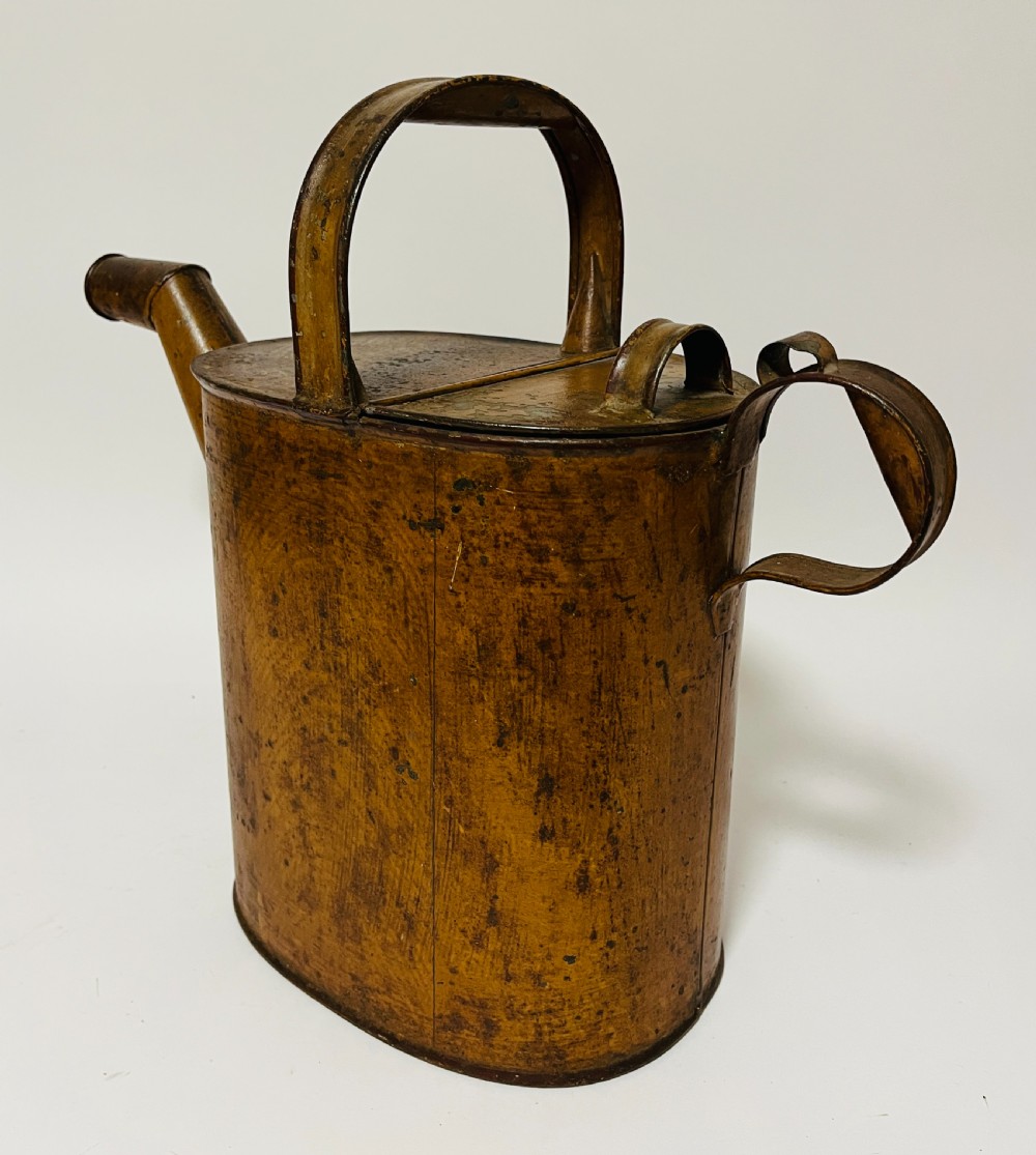 A Victorian painted tinplate hot water can featuring an overhead carrying handle, side loop handle, hinged lid, and angled spout. View III