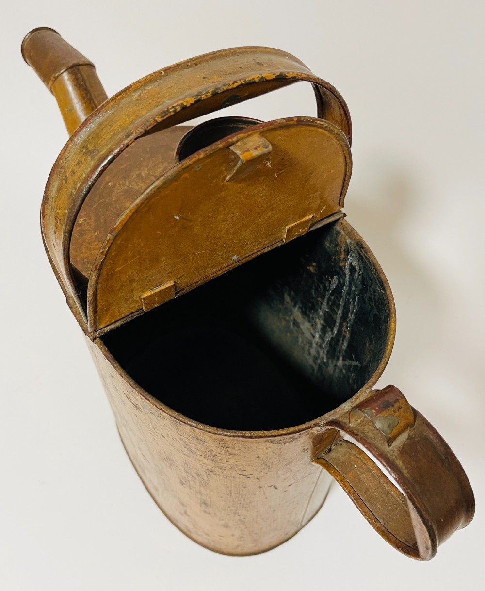 A Victorian painted tinplate hot water can featuring an overhead carrying handle, side loop handle, hinged lid, and angled spout. View VII