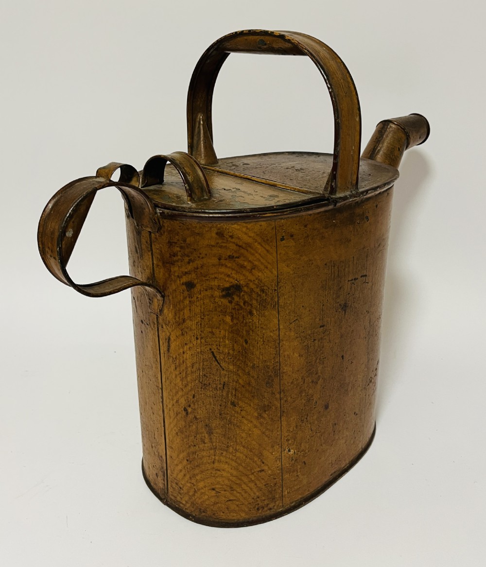 A Victorian painted tinplate hot water can featuring an overhead carrying handle, side loop handle, hinged lid, and angled spout. View XI