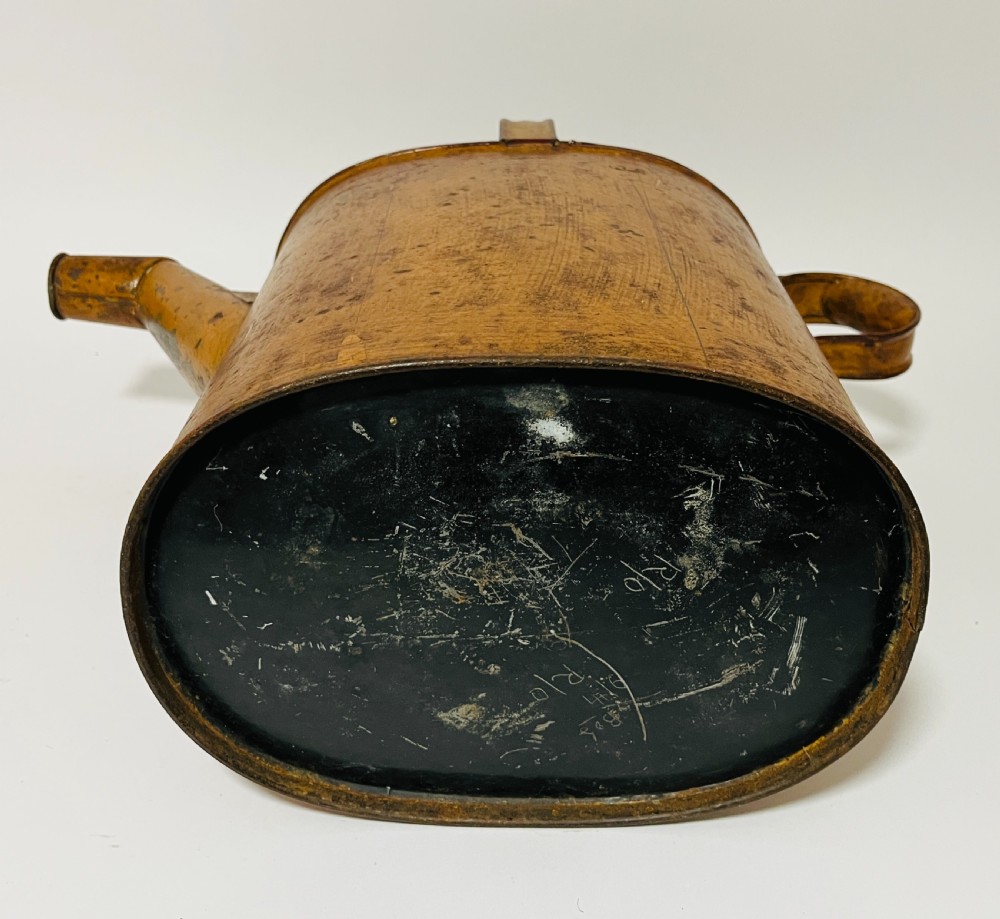 A Victorian painted tinplate hot water can featuring an overhead carrying handle, side loop handle, hinged lid, and angled spout. View XII