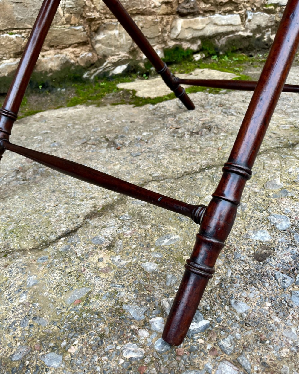 A Georgian mahogany folding butlers tray table with a scalloped gallery border, heart-shaped cut-out handles, and a turned X-frame stand. View XIII