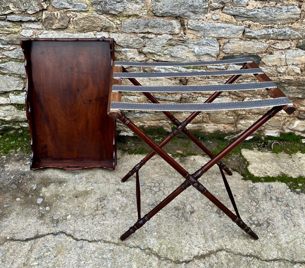 A Georgian mahogany folding butlers tray table with a scalloped gallery border, heart-shaped cut-out handles, and a turned X-frame stand. View XVI