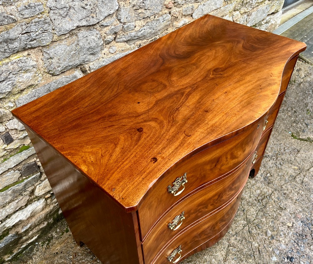 George III Serpentine Mahogany Chest of Drawers View II