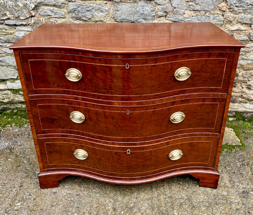 George III Serpentine Mahogany Chest of Drawers View II