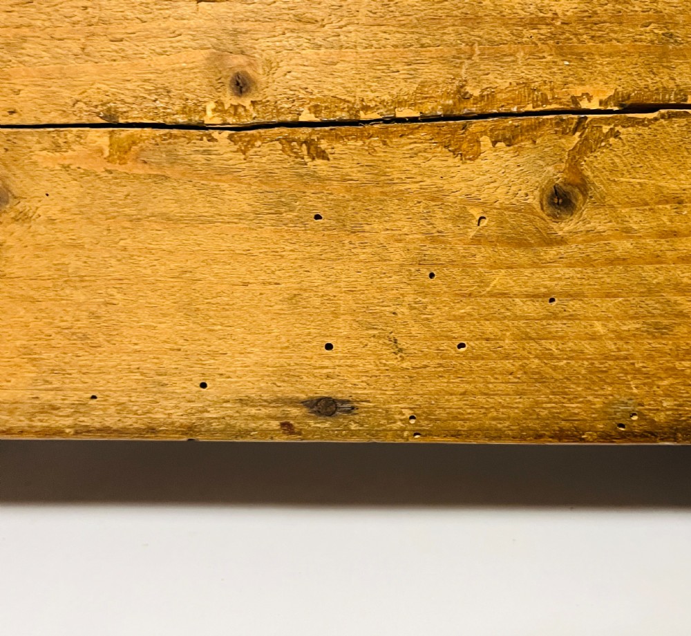 A dark stained pine miniature doll cradle featuring a hooded canopy and curved rockers. View XIII