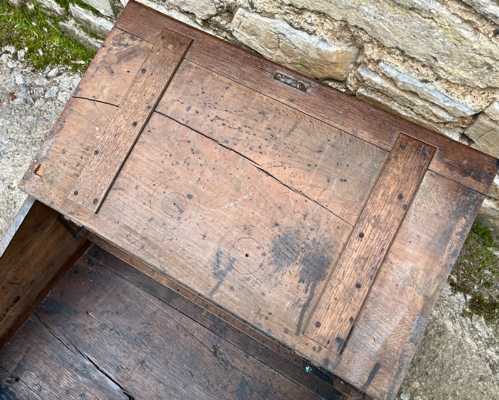 A 17th-century dark oak slant-top desk box featuring iron butterfly hinges and a central brass keyhole escutcheon. View IX