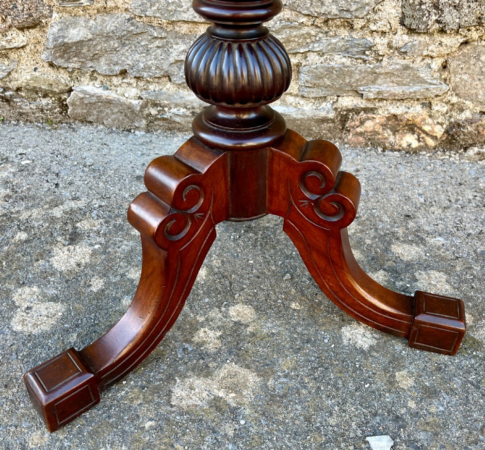 A Victorian walnut adjustable shaving stand with a circular mirror mounted on a brass stem above a small circular tabletop and turned pedestal tripod base. View III