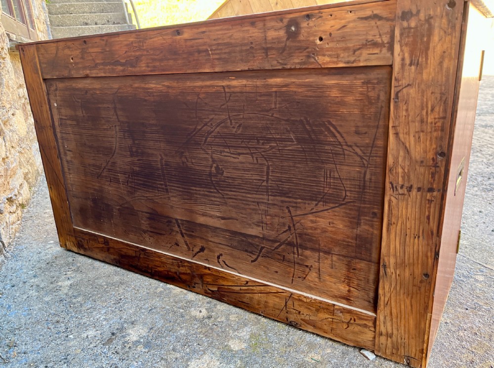A low Victorian mahogany filing cabinet featuring twin panelled doors with flame mahogany veneer and a central keyhole. View XVI