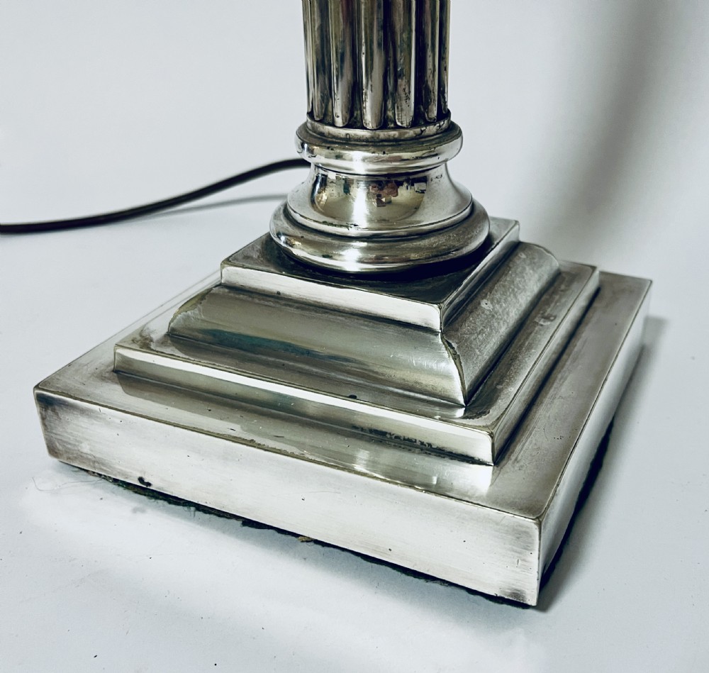 A Victorian silver-plated table lamp designed as a fluted Corinthian column with a stepped square base. View III