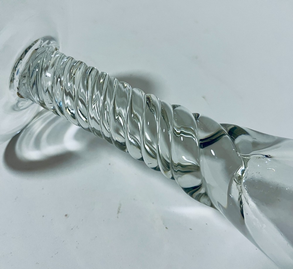 A tall clear hand-blown glass featuring a conical funnel-shaped bowl, a twisted wrythen stem, and a flat circular foot. View VI