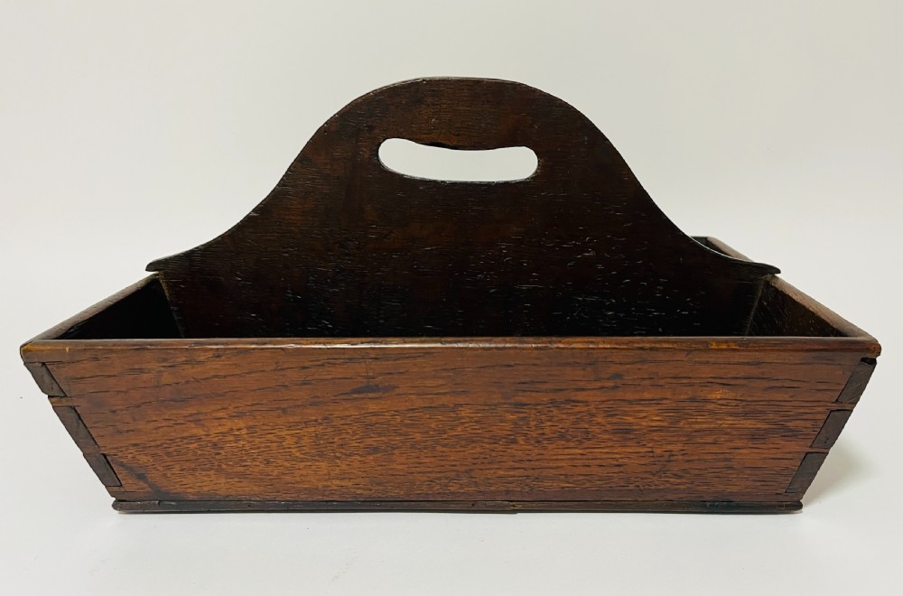 A dark brown Georgian oak cutlery tray featuring two compartments separated by a central shaped divider with a cut-out handle. View II