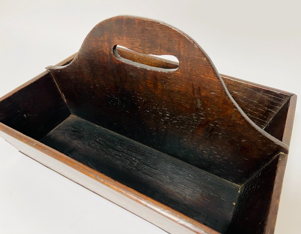 A dark brown Georgian oak cutlery tray featuring two compartments separated by a central shaped divider with a cut-out handle. View VII