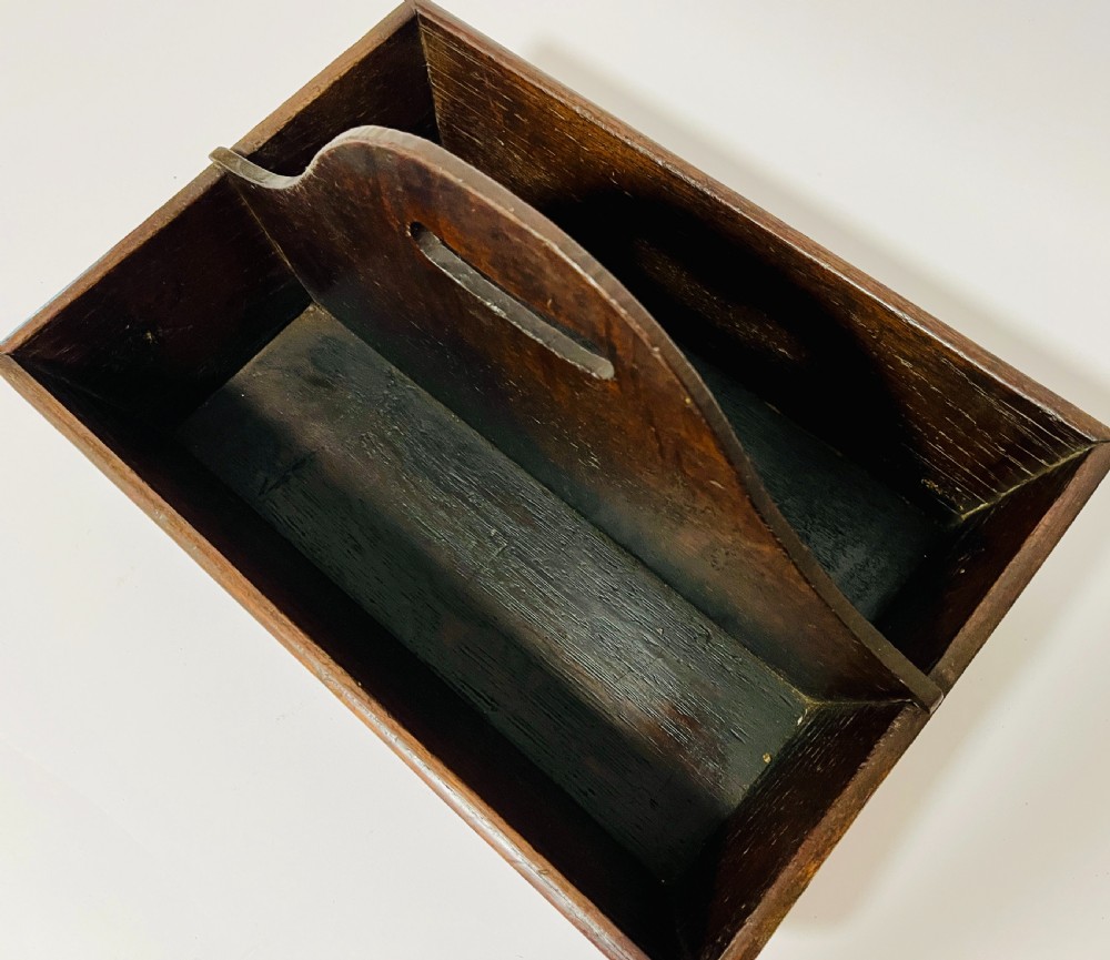 A dark brown Georgian oak cutlery tray featuring two compartments separated by a central shaped divider with a cut-out handle. View IX