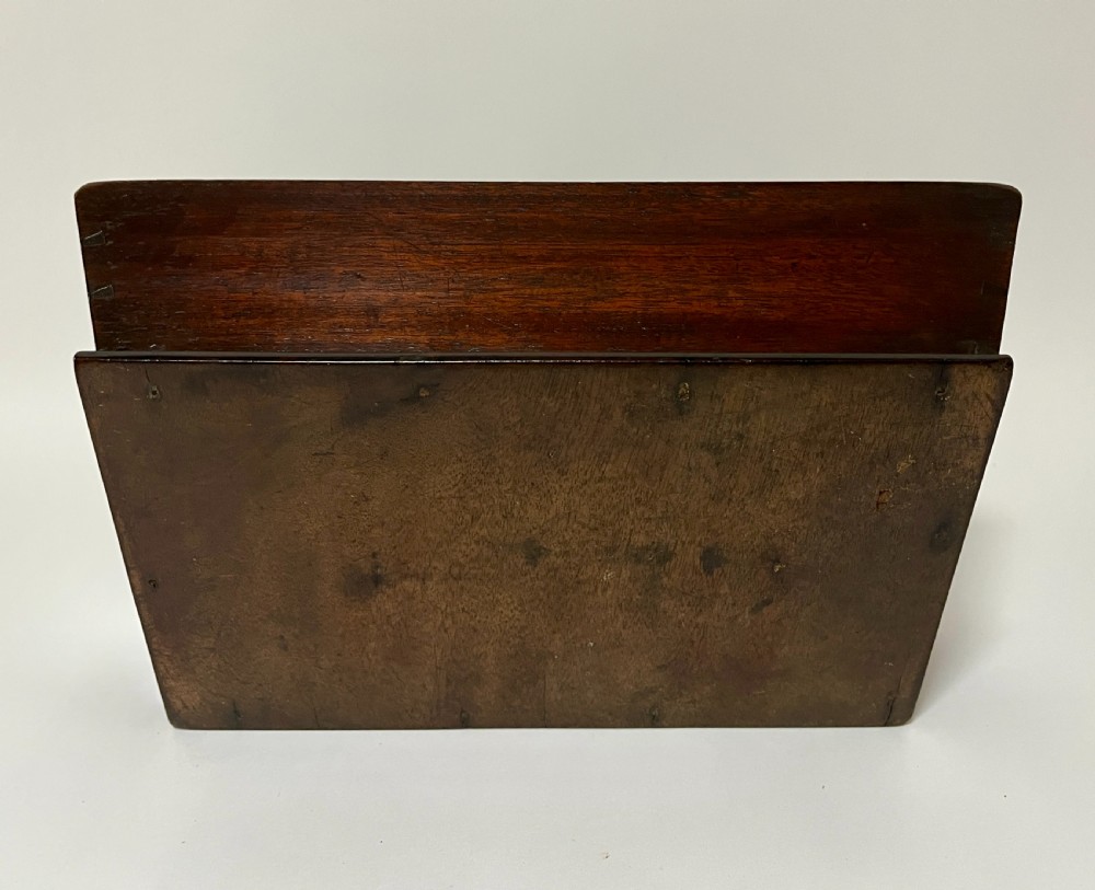 An antique Georgian dark mahogany wooden cutlery tray featuring a central division with a carved carrying handle. View XII