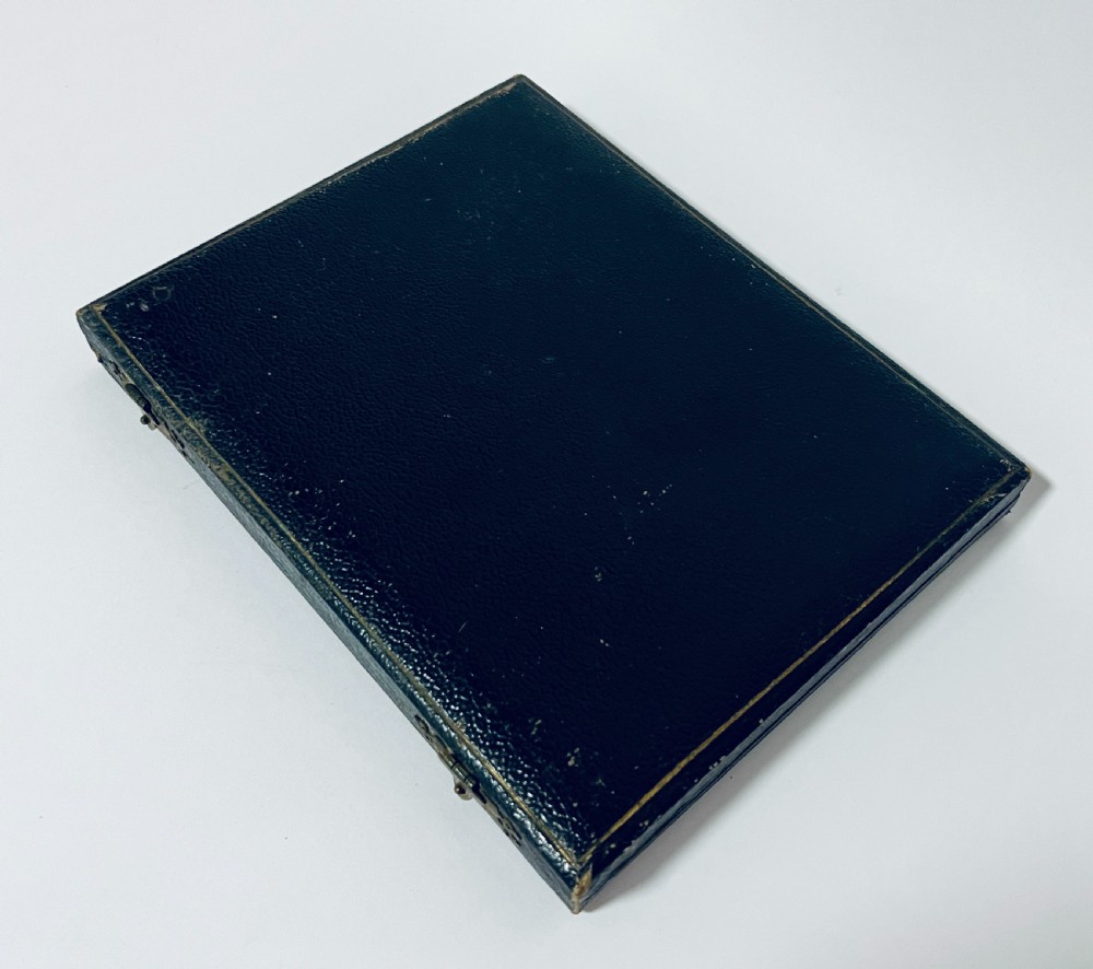A set of six antique silver-handled butter knives arranged inside a velvet and satin lined presentation case. View VI