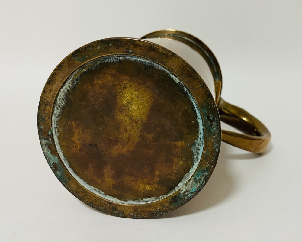 A cylindrical Victorian brass quart measure featuring a rolled rim and official stamped verification marks alongside the word QUART. View X