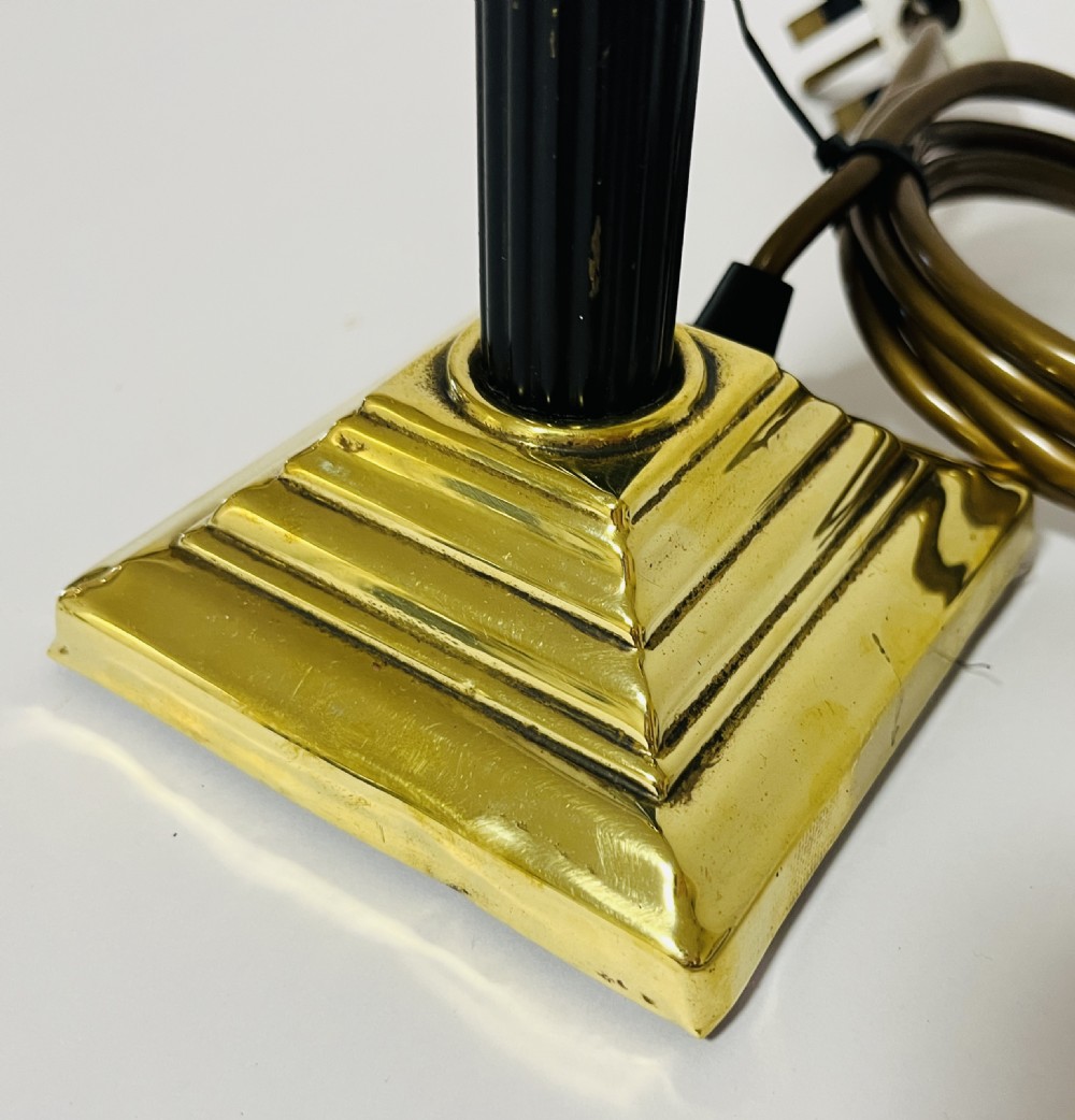 A Neoclassical Corinthian column table lamp base featuring a cast brass acanthus capital, fluted dark shaft, and stepped square brass base. View II