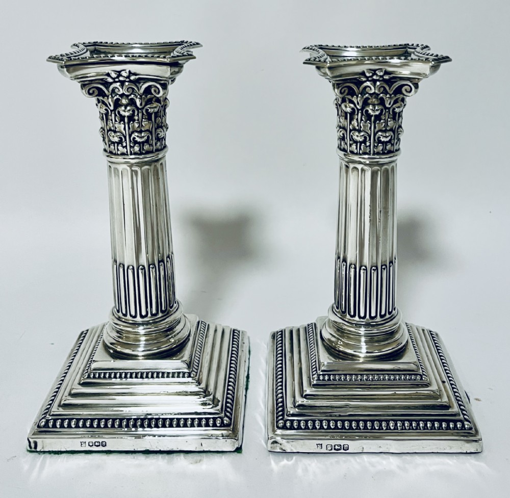 Pair of Antique Corinthian Column Silver Candlesticks