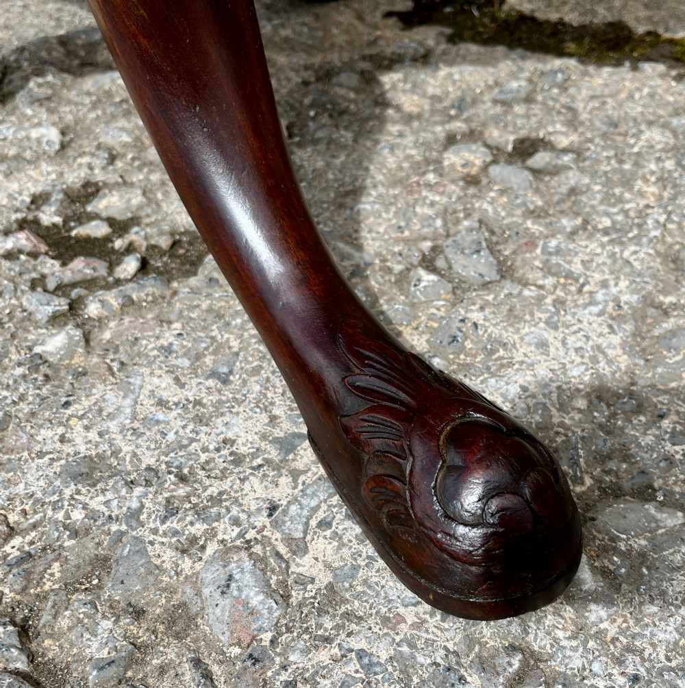 A Georgian mahogany tilt-top side table featuring a scalloped pie-crust edge, turned central column, and carved tripod cabriole legs. View XI