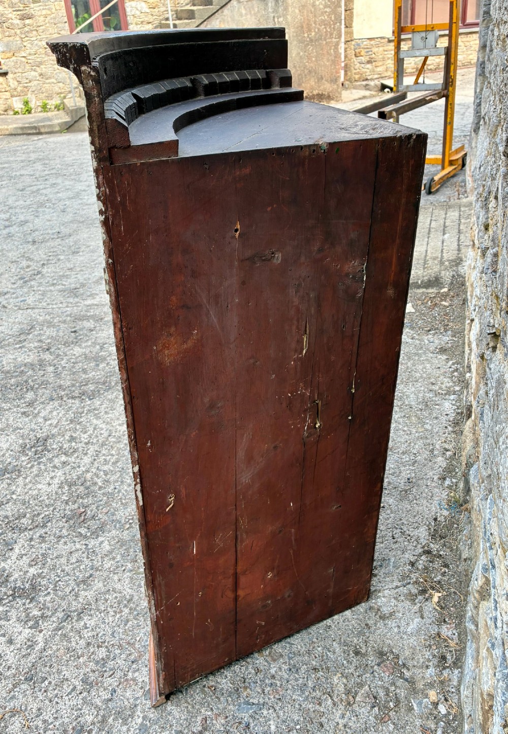 A Georgian bow-front mahogany corner cupboard featuring detailed marquetry inlays, decorative brass hinges, and central keyhole escutcheons. View IX