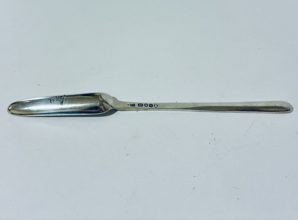 An elongated Georgian silver marrow scoop featuring a deep concave channel end tapering along a linear stem. View V