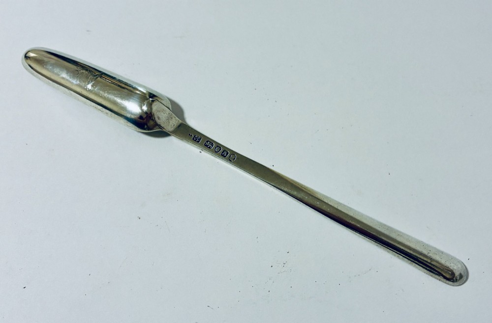 An elongated Georgian silver marrow scoop featuring a deep concave channel end tapering along a linear stem. View VI