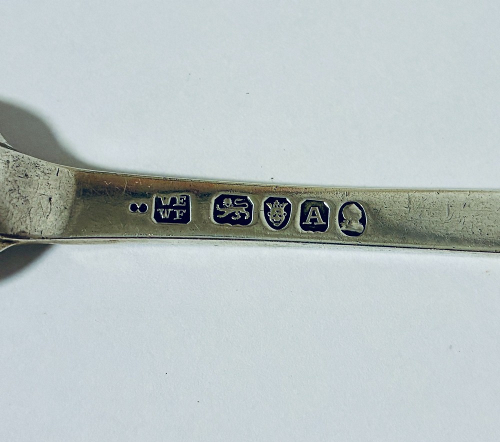 An elongated Georgian silver marrow scoop featuring a deep concave channel end tapering along a linear stem. View VII