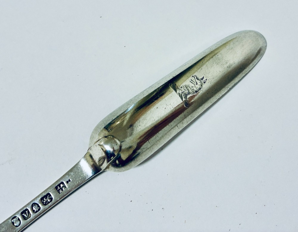 An elongated Georgian silver marrow scoop featuring a deep concave channel end tapering along a linear stem. View VIII