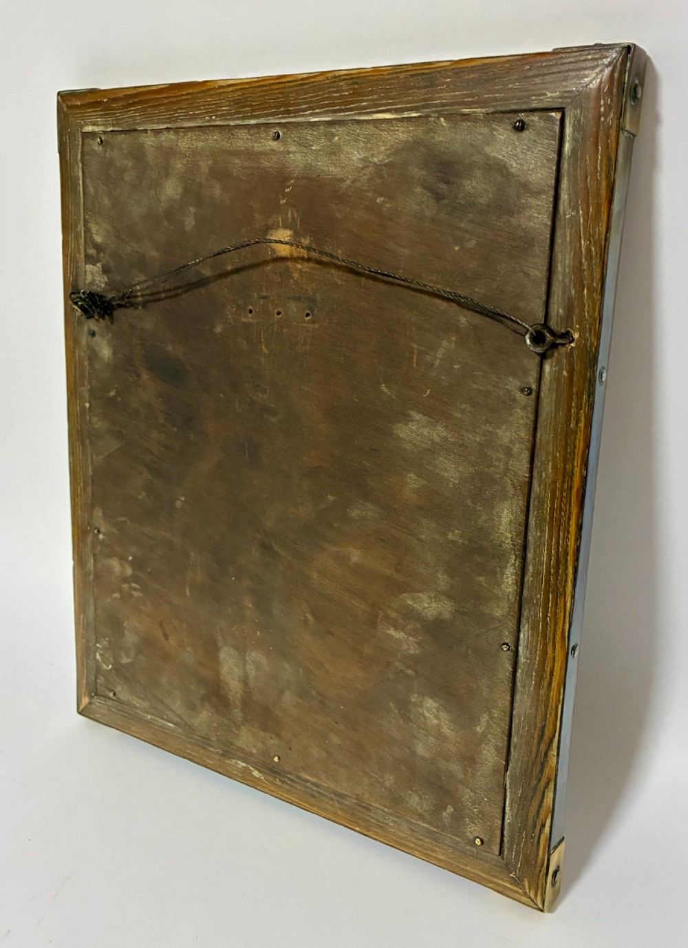 A rectangular wall mirror featuring a sheet copper frame reinforced with riveted brass corner plates. View VIII