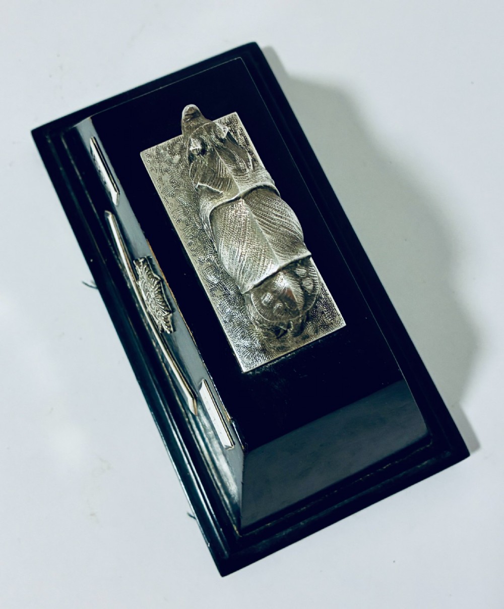 An antique silver presentation trophy featuring a detailed Indian rhinoceros figurine mounted atop a stepped ebonised wooden plinth with silver plaques. View XII