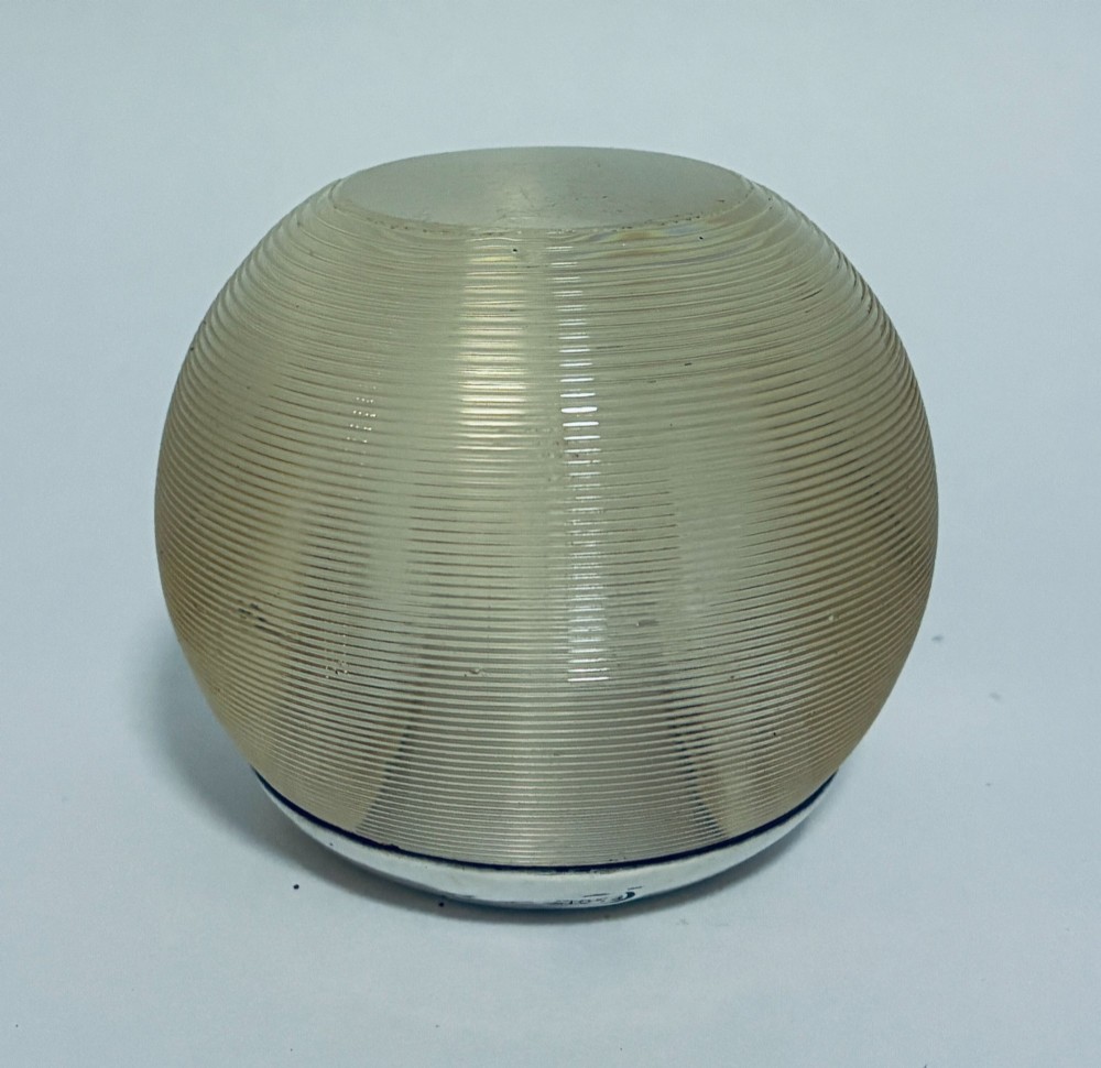 A spherical clear ribbed glass match striker featuring a polished hallmarked silver rim at the top opening. View VII