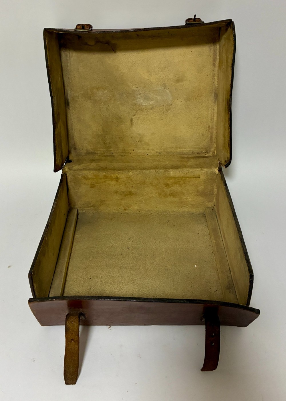 An open Victorian dark brown leather dressing case with a blue velvet-lined lid, brass lock, and compartmentalised interior sitting inside an outer leather travel box. View XIII