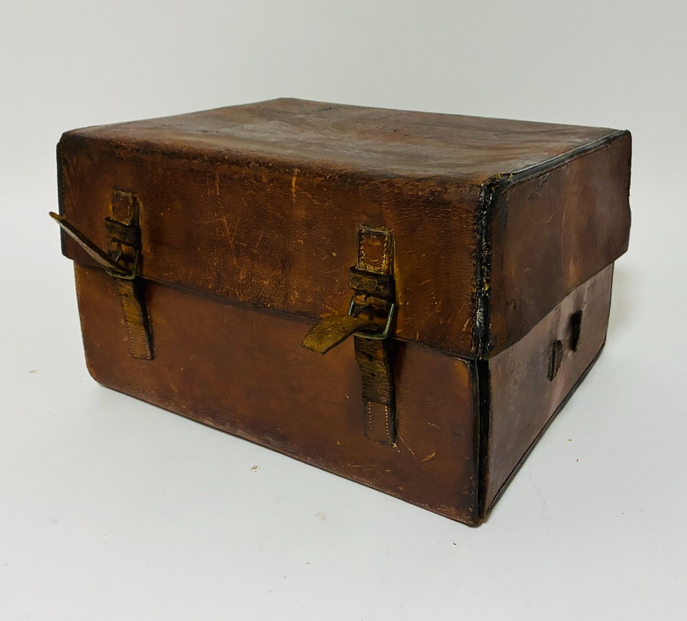 An open Victorian dark brown leather dressing case with a blue velvet-lined lid, brass lock, and compartmentalised interior sitting inside an outer leather travel box. View XIV